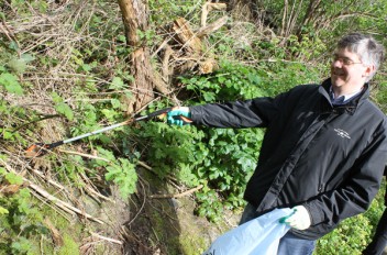 A volunteer helps out on Dodder Day 2014.