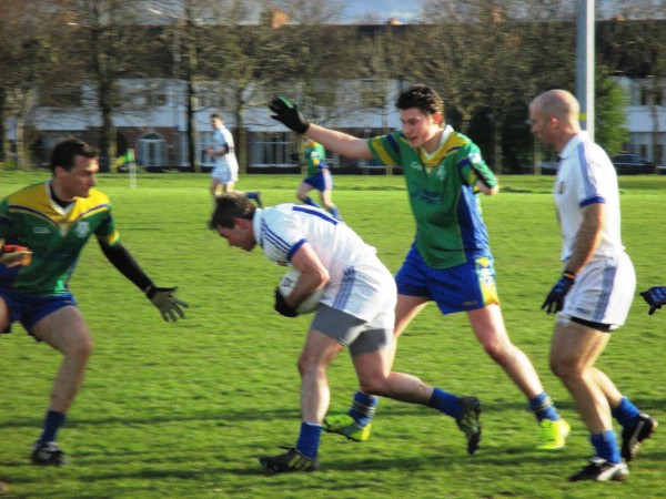 Pictured Above: The Senior footballers in action against the Garda – they’re going well in Division 3.Below: The Senior footballers in action against the Garda – they’re going well in Division 3.