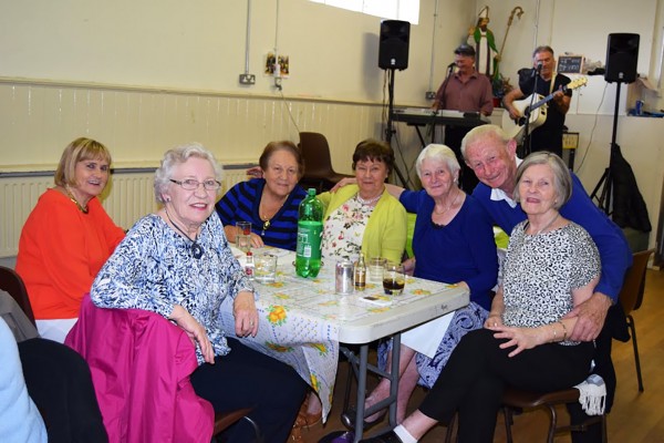 Members of the CY Active Retirement group celebrate Neighbour Day May 19th l to r Noeleen Dunwoody, Theresa Westby, Maura Flahive, Dolores Timmins, Kay Flood, Derek Murphy, Marie Connolly and band Pastimes in the background.