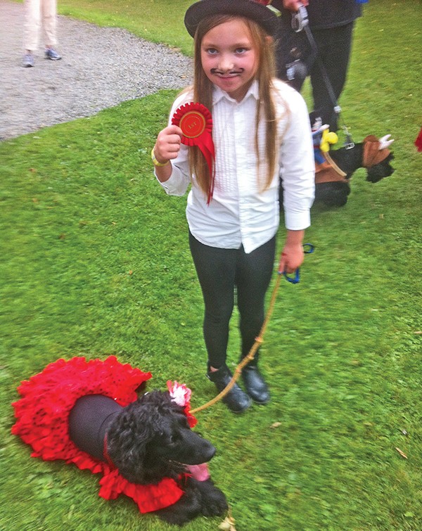 Pictured Above: Nora Kingston-Walker and Treacle the dog. Image by Steve Kingston.