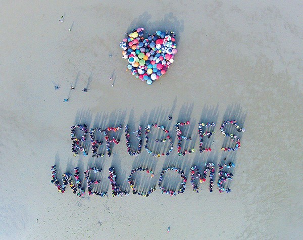 Pictured: Aerial ‘Refugees Welcome’ message on Sunday September 13th. Image by Steve Kingston.