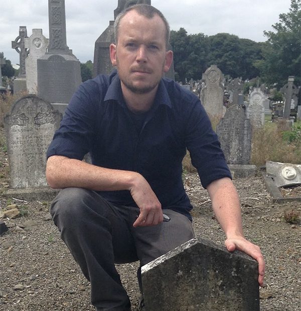Pictured Above: Pádraig Óg Ó Ruairc pictured at Margaret Keogh’s graveside in Glasnevin Cemetery. 