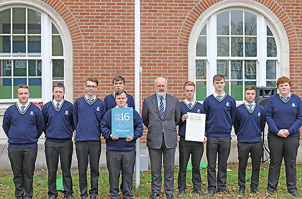 Pictured: Proclamation Day at Marian College, Ballsbridge. Senior History students together with the Principal Mr. Paul Meany standing below the tricolour. Adam Kavanagh, the College Captain and 5th year student Mark Stafford are holding a copy of the Proclamation of Independence which they received from President Michael D. Higgins.