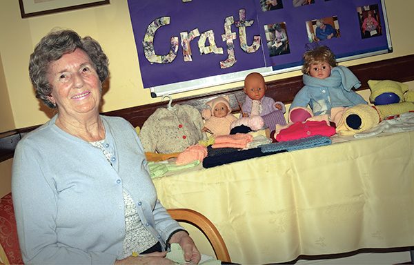 Pictured: Jean Gilshinan with some of the baby clothes which she and her friends produce. Photo: Kevin O’Gorman.